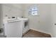 Laundry room with modern appliances and ample storage space at 36 Crescent Chase, Dallas, GA 30157