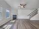 Bright, open living room with hardwood floors, fireplace, and staircase at 36 Crescent Chase, Dallas, GA 30157
