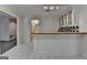 A bar area featuring white cabinets with glass doors and a black and white checkered backsplash at 5245 Cottage Farm Rd, Johns Creek, GA 30022