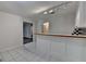 A bar area featuring white cabinets with glass doors and a black and white checkered backsplash at 5245 Cottage Farm Rd, Johns Creek, GA 30022