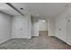 View of the basement with gray carpet, neutral walls, and white trim at 5245 Cottage Farm Rd, Johns Creek, GA 30022