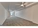 Finished basement with carpeted floors and a ceiling fan at 5245 Cottage Farm Rd, Johns Creek, GA 30022