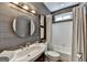 Updated bathroom features modern vanity, gray wallpaper, and shower-tub combination at 5245 Cottage Farm Rd, Johns Creek, GA 30022