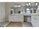 Bathroom featuring dual vanities, a large mirror, and plenty of counter space at 5245 Cottage Farm Rd, Johns Creek, GA 30022
