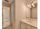 Bright bathroom with a single sink vanity and a separate shower area at 5245 Cottage Farm Rd, Johns Creek, GA 30022