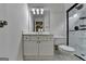 Bathroom with a white vanity, tiled shower, and modern fixtures, creating a sleek and functional space at 5245 Cottage Farm Rd, Johns Creek, GA 30022