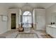 Elegant bathroom featuring a soaking tub, glass shower, and natural light, complete with tiled floors at 5245 Cottage Farm Rd, Johns Creek, GA 30022