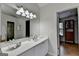 Bathroom featuring a vanity, a large mirror, a linen closet, and an open doorway at 5245 Cottage Farm Rd, Johns Creek, GA 30022