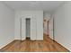 Bedroom featuring hardwood floors, a closet, and natural light at 5245 Cottage Farm Rd, Johns Creek, GA 30022