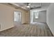 A carpeted bedroom features a ceiling fan, recessed lighting, and a window at 5245 Cottage Farm Rd, Johns Creek, GA 30022