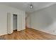 Bedroom featuring hardwood floors, a closet, and natural light at 5245 Cottage Farm Rd, Johns Creek, GA 30022