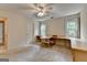 Bedroom featuring neutral carpet, windows, and a ceiling fan at 5245 Cottage Farm Rd, Johns Creek, GA 30022