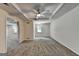 Spacious bedroom with a ceiling fan, neutral carpet, and a large window to bring in natural light at 5245 Cottage Farm Rd, Johns Creek, GA 30022