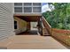 Large wooden deck with access to the backyard and ample space for outdoor entertaining at 5245 Cottage Farm Rd, Johns Creek, GA 30022