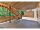 Spacious outdoor deck with wooden stairs and supports, providing ample room for entertaining at 5245 Cottage Farm Rd, Johns Creek, GA 30022