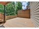 Outdoor deck with lush greenery, providing a serene setting for relaxing and enjoying nature at 5245 Cottage Farm Rd, Johns Creek, GA 30022