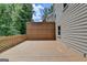 Expansive wooden deck with a privacy screen, perfect for outdoor gatherings and relaxation at 5245 Cottage Farm Rd, Johns Creek, GA 30022