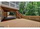 Spacious backyard deck with access to a lower-level patio and landscaped yard at 5245 Cottage Farm Rd, Johns Creek, GA 30022