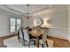 This dining room features chandelier lighting, and access to window with shutter-style covers at 5245 Cottage Farm Rd, Johns Creek, GA 30022