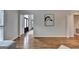 Inviting entryway with hardwood floors and elegant black doors, providing a warm welcome to the home at 5245 Cottage Farm Rd, Johns Creek, GA 30022
