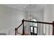 Grand foyer with a modern chandelier, staircase and light-filled entrance at 5245 Cottage Farm Rd, Johns Creek, GA 30022