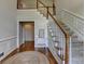 Bright foyer with hardwood floors, staircase, and classic trim at 5245 Cottage Farm Rd, Johns Creek, GA 30022
