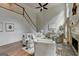 Cozy living room featuring a fireplace, staircase, and ample seating for relaxing and entertaining at 5245 Cottage Farm Rd, Johns Creek, GA 30022