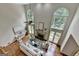 Living room with high ceilings, large windows, fireplace and abundant natural light at 5245 Cottage Farm Rd, Johns Creek, GA 30022