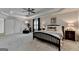 Expansive main bedroom features a ceiling fan, tray ceiling, sitting area, and ensuite bathroom access at 5245 Cottage Farm Rd, Johns Creek, GA 30022