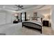 Expansive main bedroom features a ceiling fan, tray ceiling, sitting area, and ensuite bathroom at 5245 Cottage Farm Rd, Johns Creek, GA 30022