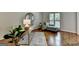 Stylish home office featuring hardwood floors, natural light, and a comfortable chaise lounge at 5245 Cottage Farm Rd, Johns Creek, GA 30022