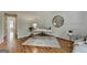Office features hardwood floors, natural light, and round mirror at 5245 Cottage Farm Rd, Johns Creek, GA 30022