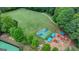 Aerial view of recreational area with playground, sports court and green space at 5245 Cottage Farm Rd, Johns Creek, GA 30022