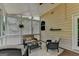 Inviting screened porch with wicker furniture, ceiling fan and lattice privacy screen at 5245 Cottage Farm Rd, Johns Creek, GA 30022