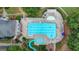 Aerial view of a community pool with slide and water features, ideal for Gathering fun and relaxation in the sun at 5245 Cottage Farm Rd, Johns Creek, GA 30022