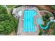 Overhead view of a large community pool with a slide and water features, perfect for summer fun and relaxation at 5245 Cottage Farm Rd, Johns Creek, GA 30022