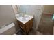 Bathroom featuring a toilet, sink vanity, and mirror at 9230 Melody Sw Cir, Covington, GA 30014