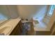 Bathroom features a bathtub and a single vanity, offering comfort and functionality at 9230 Melody Sw Cir, Covington, GA 30014