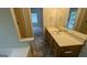 Bathroom with bathtub, vanity, and a door looking into another room at 9230 Melody Sw Cir, Covington, GA 30014