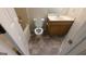 This bathroom includes a toilet, bathtub, and sink, with tiled floors at 9230 Melody Sw Cir, Covington, GA 30014