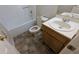 Bathroom featuring a tub, toilet, and vanity sink at 9230 Melody Sw Cir, Covington, GA 30014