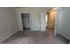 A roomy bedroom features carpeted floors and closet with shelving at 9230 Melody Sw Cir, Covington, GA 30014