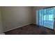 Carpeted bedroom with sliding glass door access to outdoors at 9230 Melody Sw Cir, Covington, GA 30014