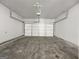 A clean garage with a sealed concrete floor and an automatic door at 36 Crescent Chase, Dallas, GA 30157