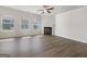 Bright living room with hardwood floors, a fireplace, and multiple windows for plenty of natural light at 36 Crescent Chase, Dallas, GA 30157