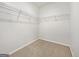 Walk-in closet featuring wire shelving and neutral carpet at 36 Crescent Chase, Dallas, GA 30157