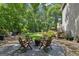 Backyard featuring a gravel area with a fire pit and lounge chairs, perfect for outdoor entertaining at 750 Crest Valley Nw Dr, Sandy Springs, GA 30327