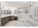 Large bathroom with double vanity, shower, and soaking tub at 750 Crest Valley Nw Dr, Sandy Springs, GA 30327