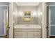 Bathroom features a vanity with black and white tile accent mirror at 750 Crest Valley Nw Dr, Sandy Springs, GA 30327