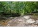 Scenic creek and surrounding foliage, offering a peaceful and serene natural setting at 750 Crest Valley Nw Dr, Sandy Springs, GA 30327
